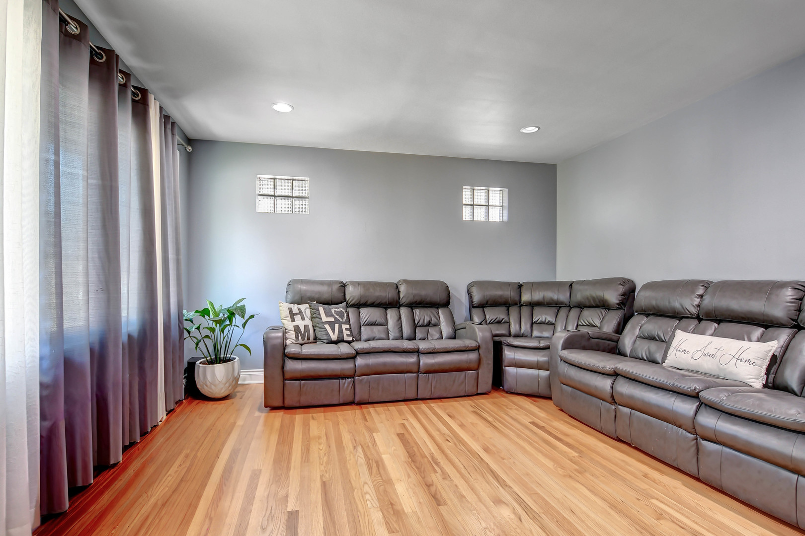5700 South Monitor Avenue Chicago, IL 60638 - Photo 3 of 22 a living room with furniture and a potted plant