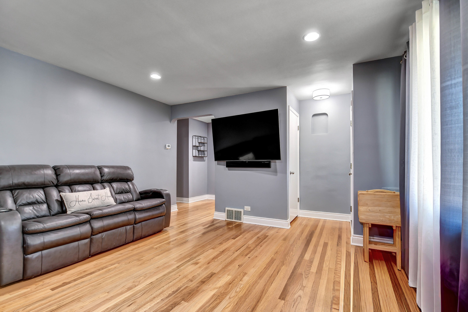 5700 South Monitor Avenue Chicago, IL 60638 - Photo 4 of 22 a living room with furniture and a flat screen tv