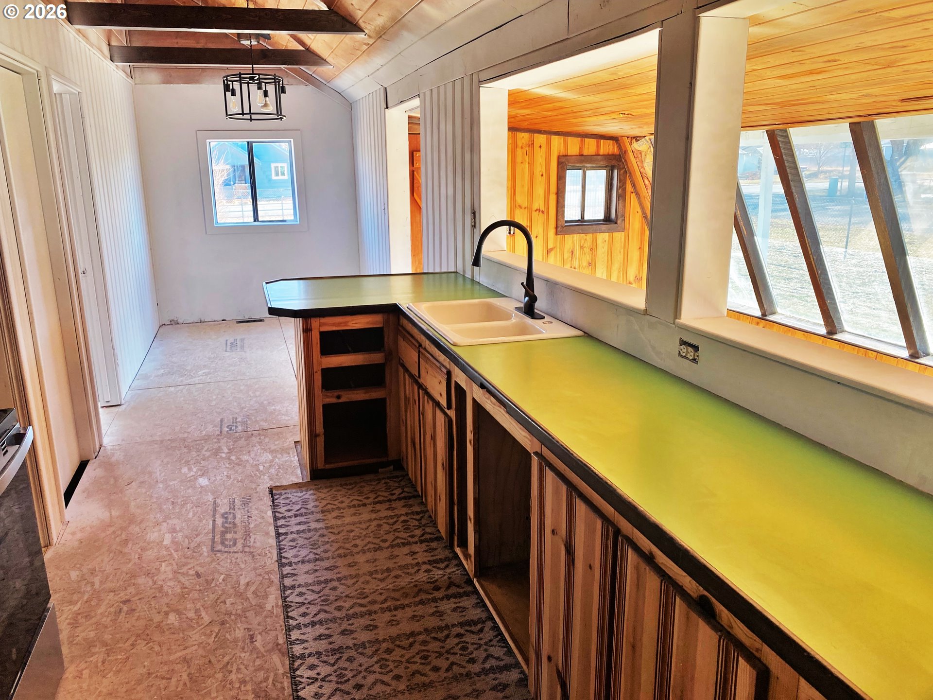 1905 17th Street Baker City, OR 97814 - Photo 3 of 13 a bathroom with a sink and a window