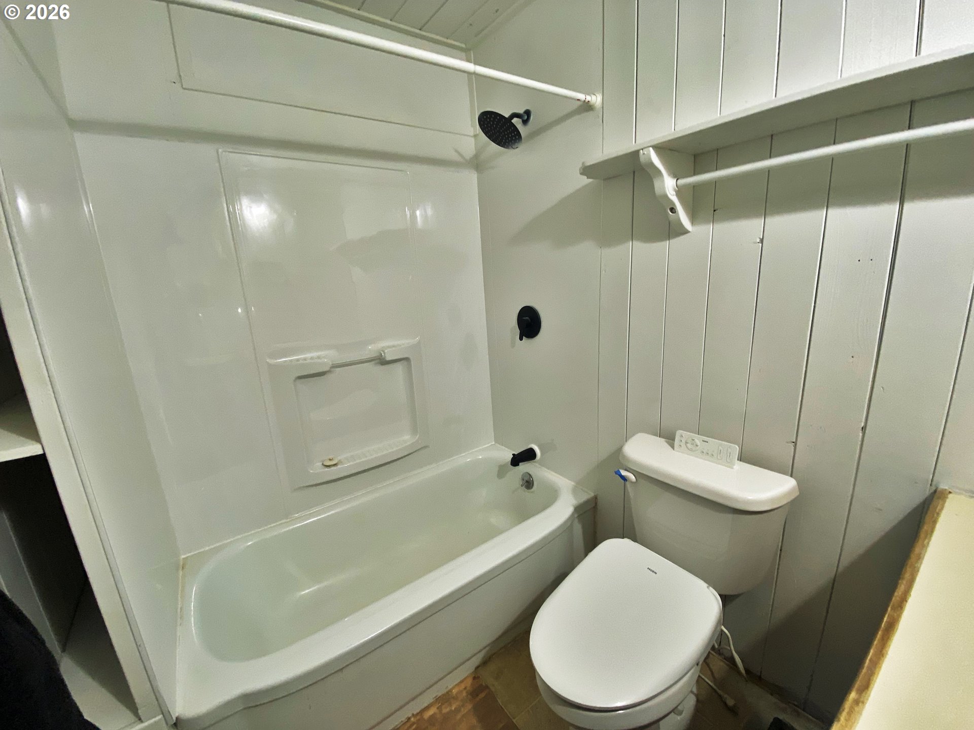 1905 17th Street Baker City, OR 97814 - Photo 8 of 13 a white toilet sitting next to a bath tub