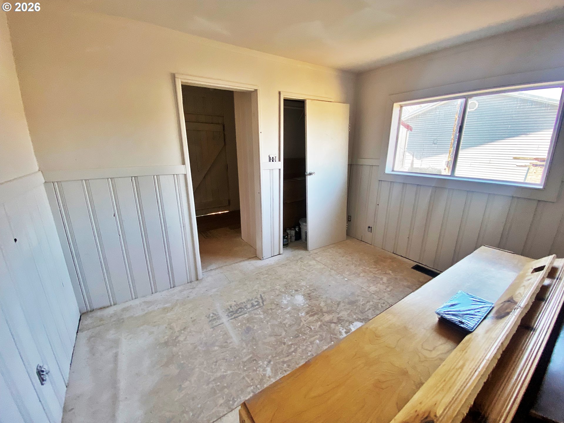 1905 17th Street Baker City, OR 97814 - Photo 10 of 13 a view of a bedroom with wooden floor and windows