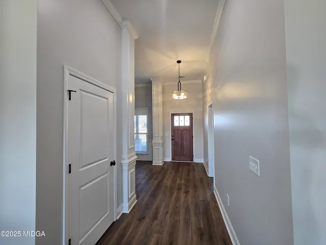 a view of a livingroom from a hallway