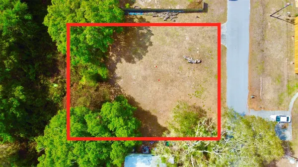 a sign that is sitting in a garden