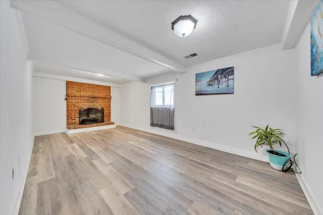 a view of a house with snow on the road