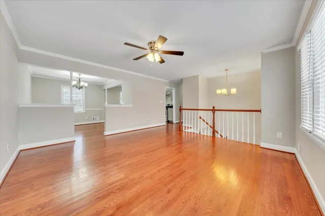 a kitchen with white cabinets and appliances