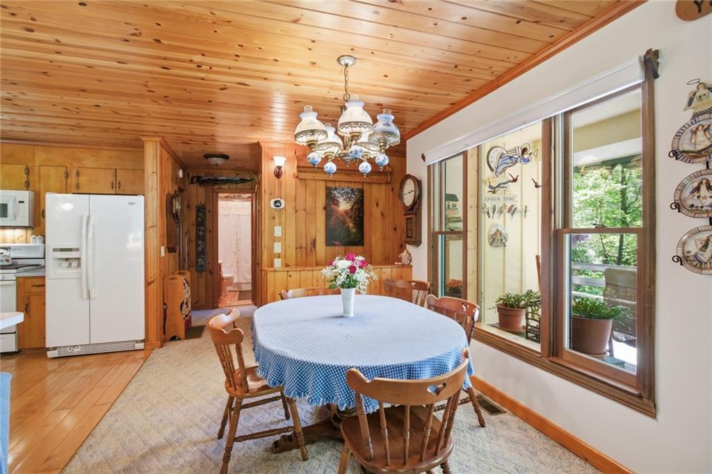 46 Spartan Lane Rabun Gap, GA 30568 - Photo 21 of 89 a view of a dining room with furniture window and outside view