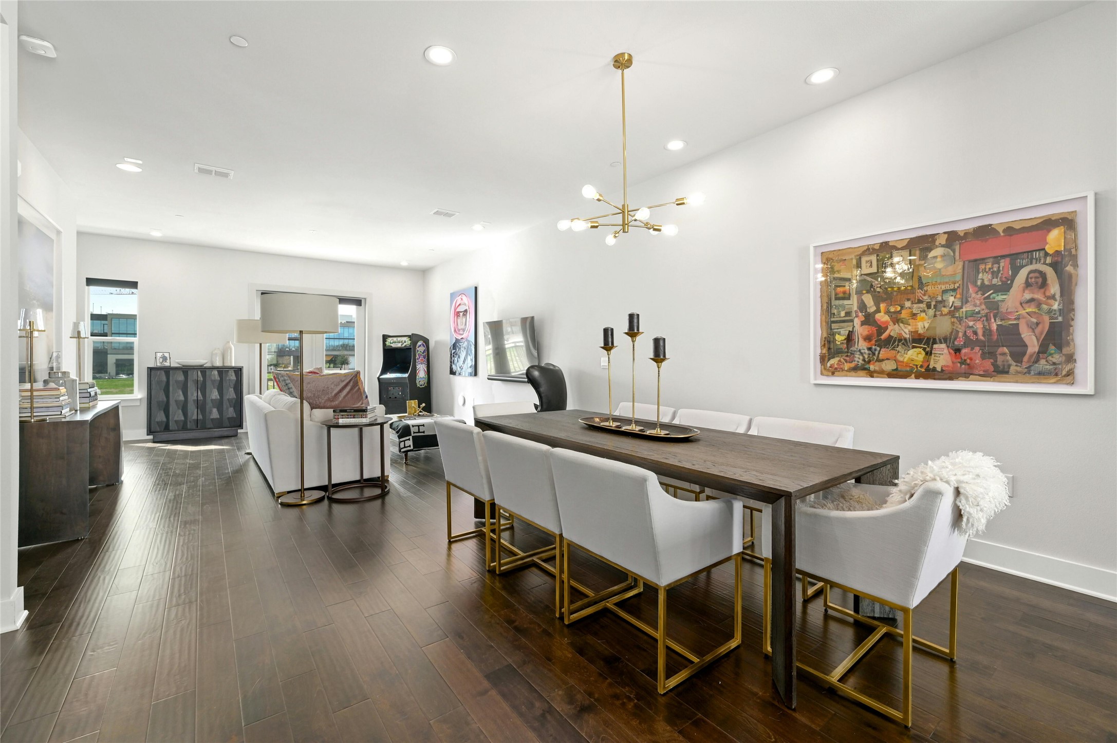 a view of a dining room with furniture and wooden floor