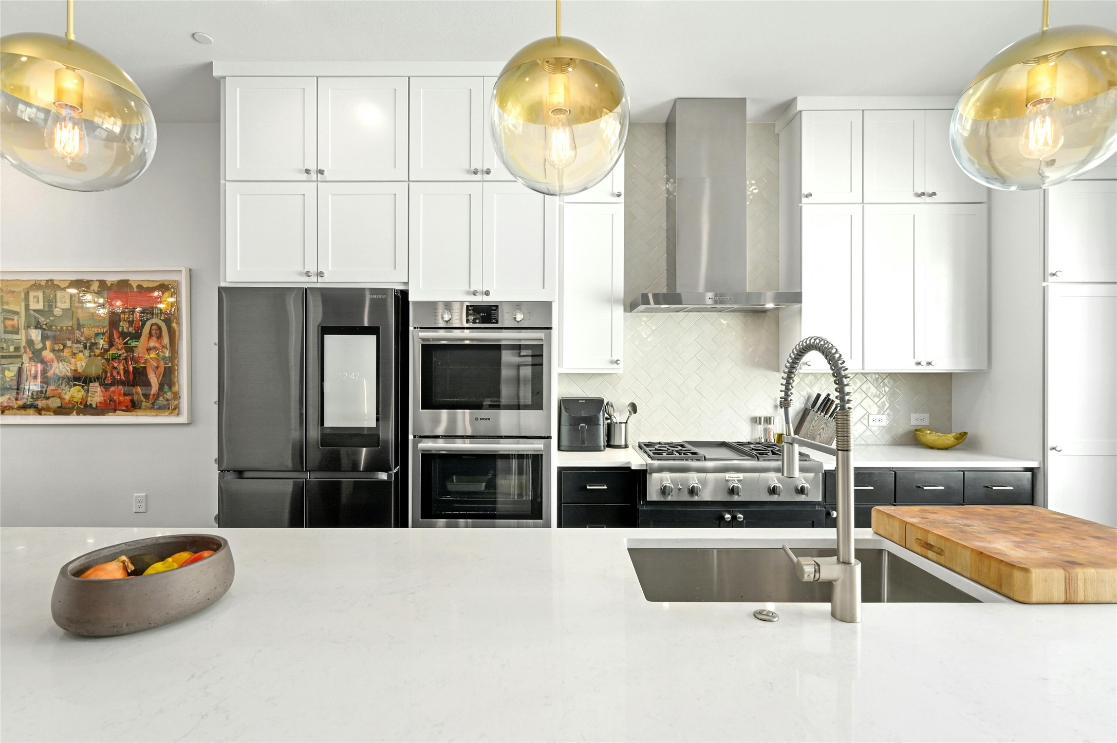 4604 Longevity Drive, Unit 306 Austin, TX 78731 - Photo 12 of 34 a kitchen with stainless steel appliances granite countertop a sink a stove and a microwave