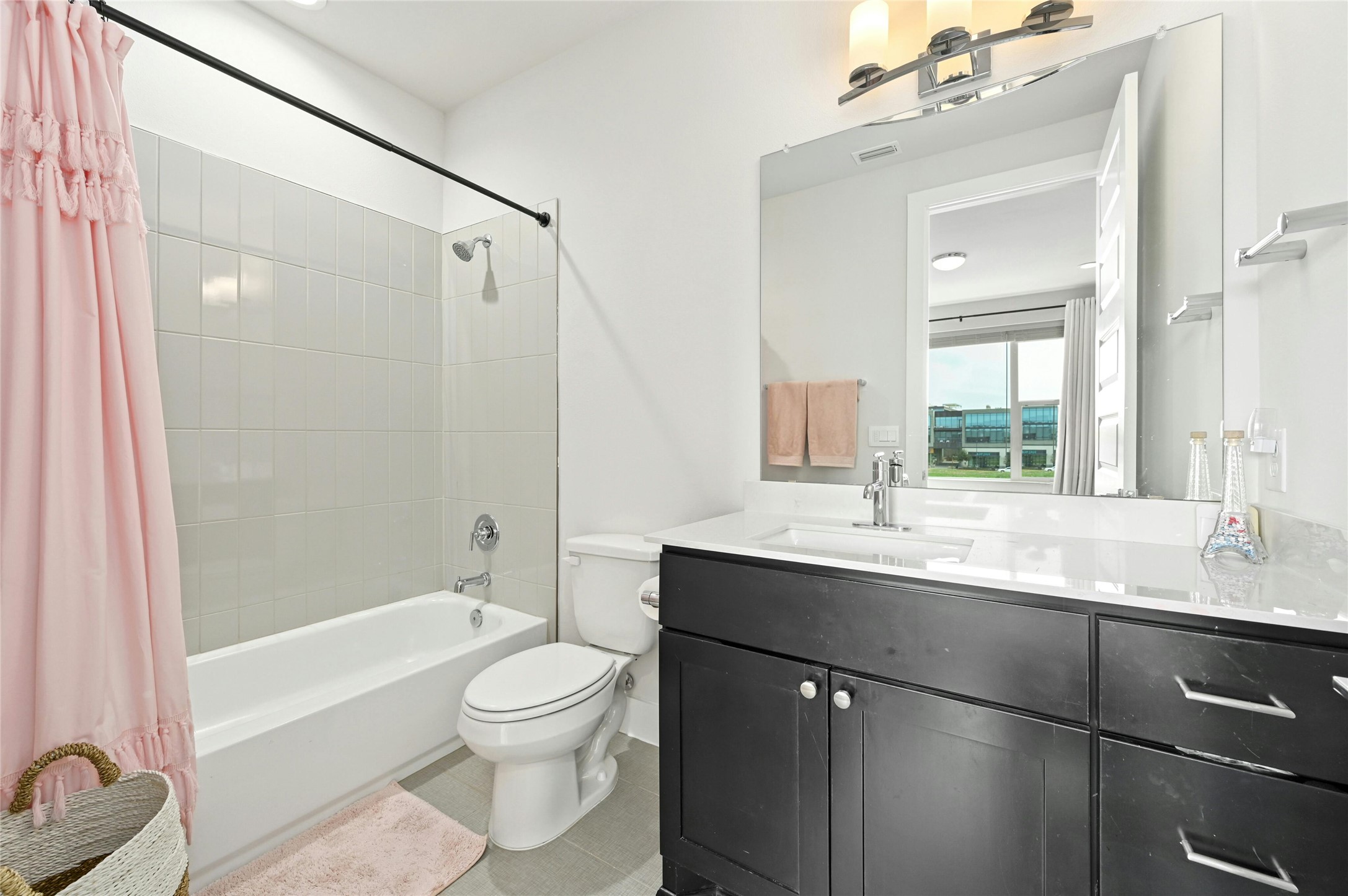 4604 Longevity Drive, Unit 306 Austin, TX 78731 - Photo 21 of 34 a bathroom with a sink a toilet and shower