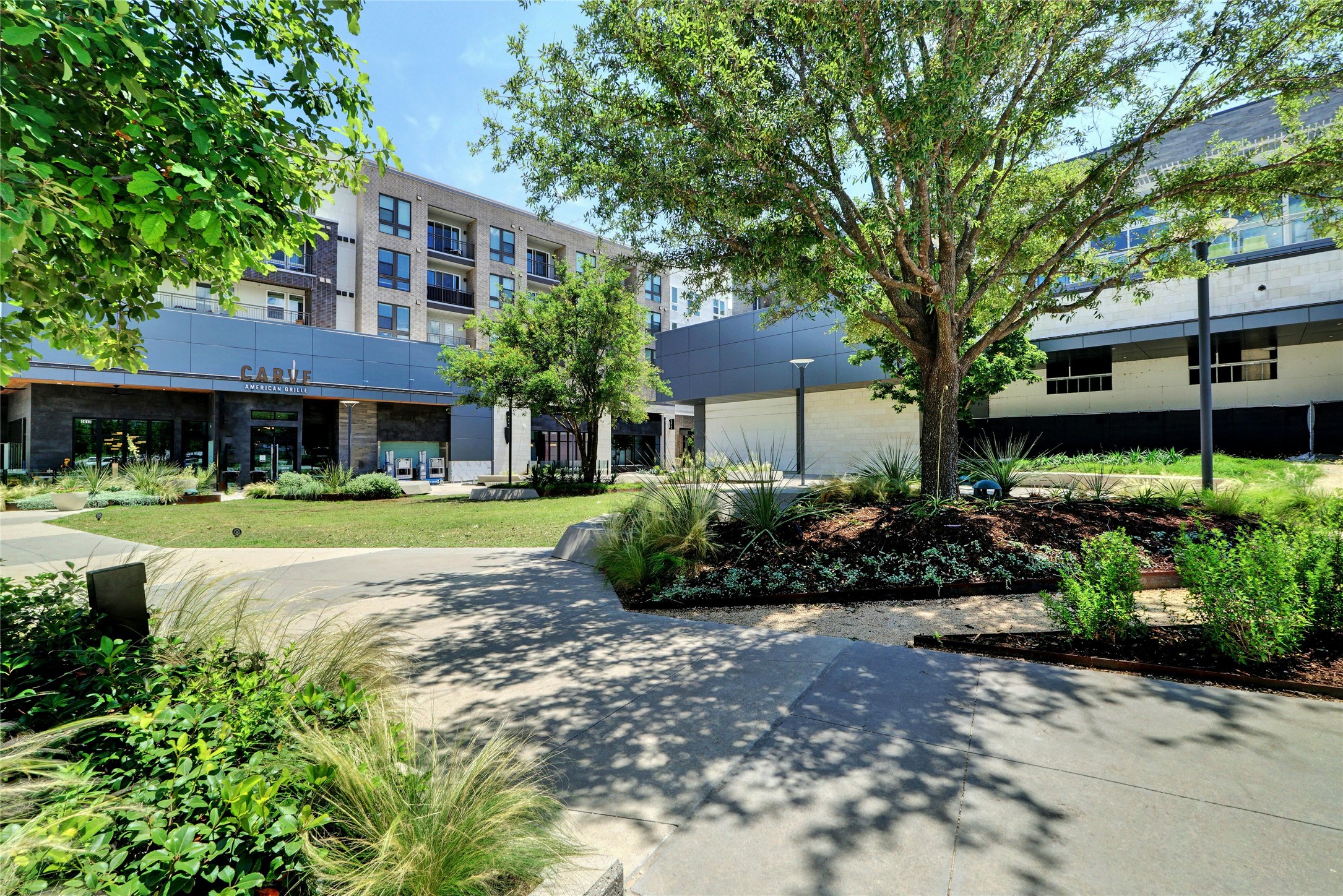 4604 Longevity Drive, Unit 306 Austin, TX 78731 - Photo 24 of 34 a view of a house with a garden