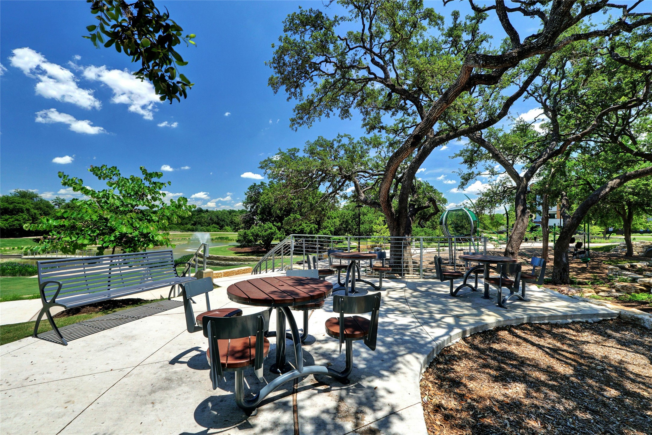 4604 Longevity Drive, Unit 306 Austin, TX 78731 - Photo 27 of 34 a view of a patio with chairs and table
