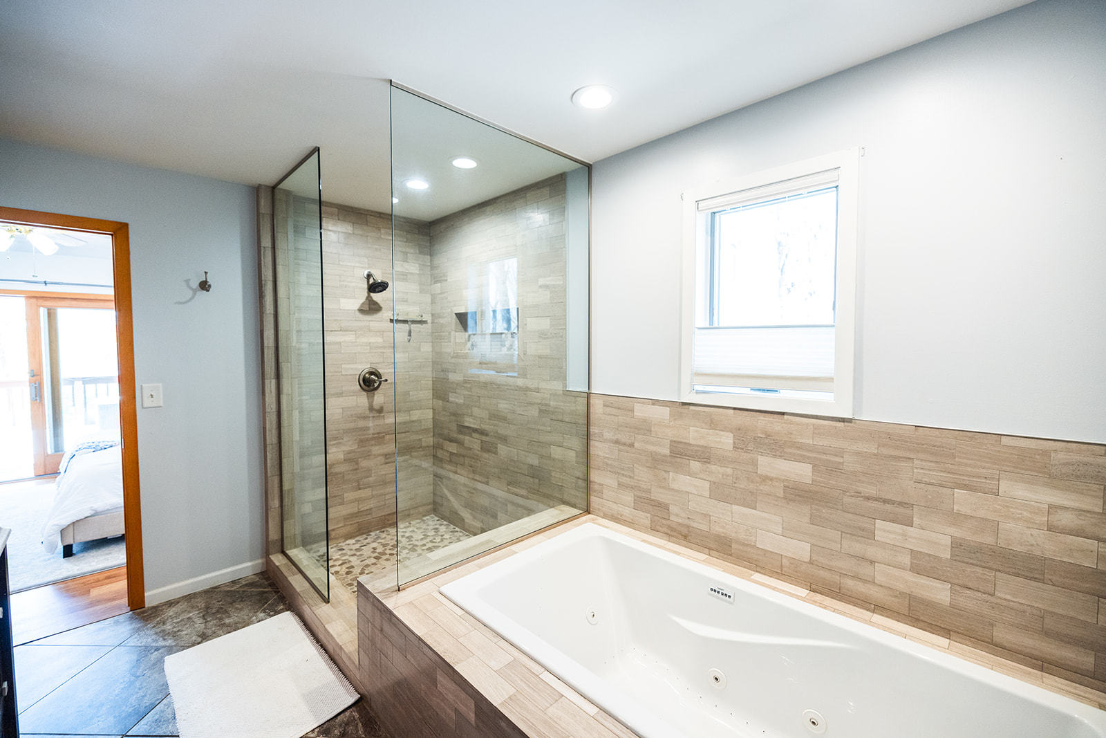 147 Lake Thunderbird Drive Putnam, IL 61560 - Photo 18 of 50 a bathroom with a bathtub and a shower