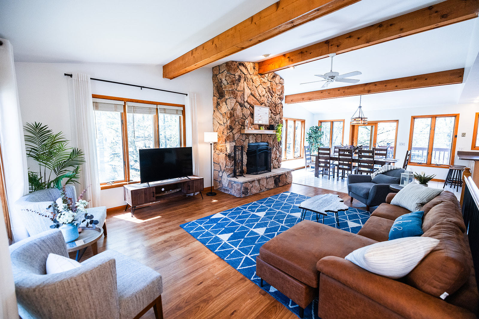 147 Lake Thunderbird Drive Putnam, IL 61560 - Photo 2 of 50 a living room with furniture floor to ceiling window and a flat screen tv
