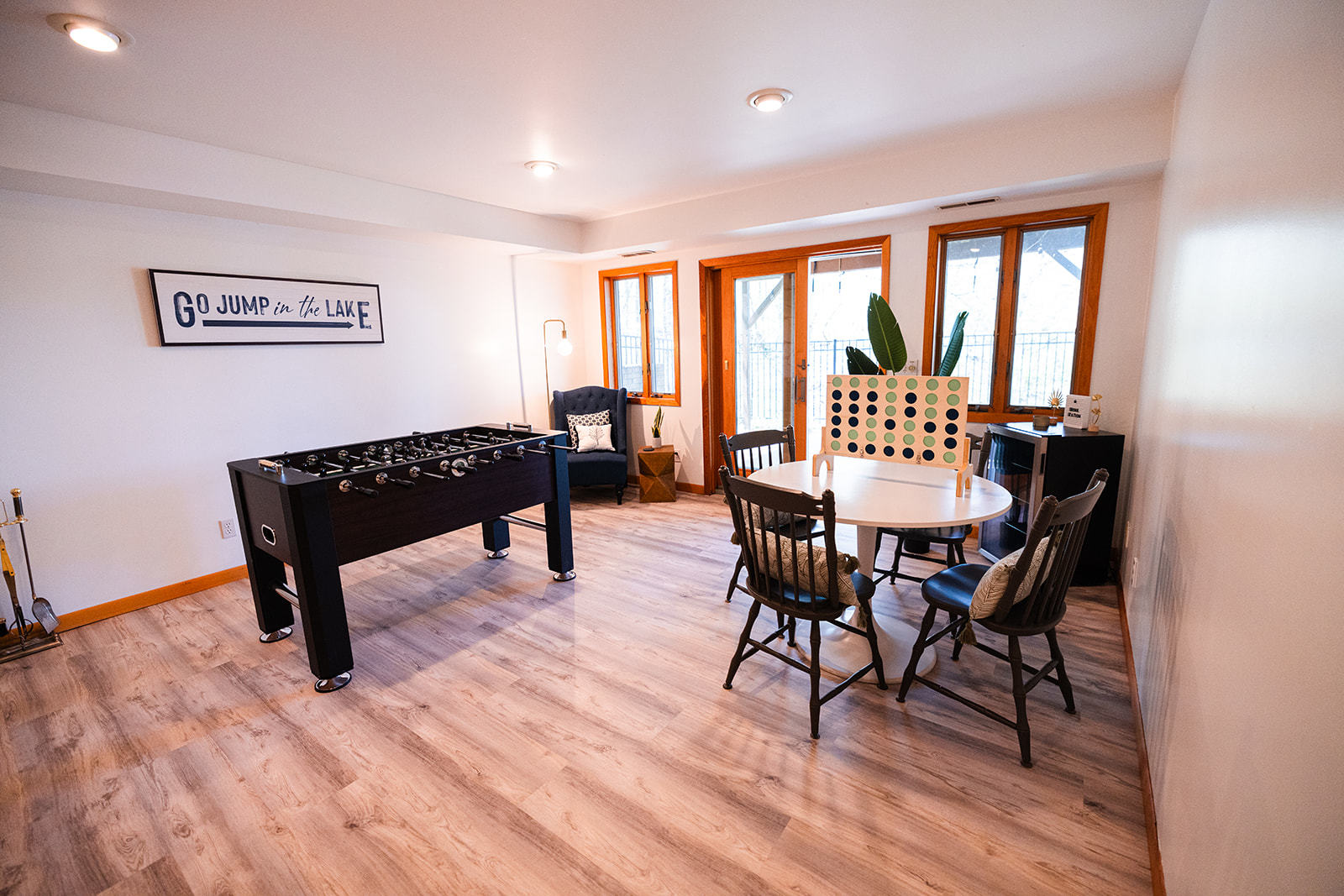 147 Lake Thunderbird Drive Putnam, IL 61560 - Photo 29 of 50 a dining room with wooden floor a glass table and chairs