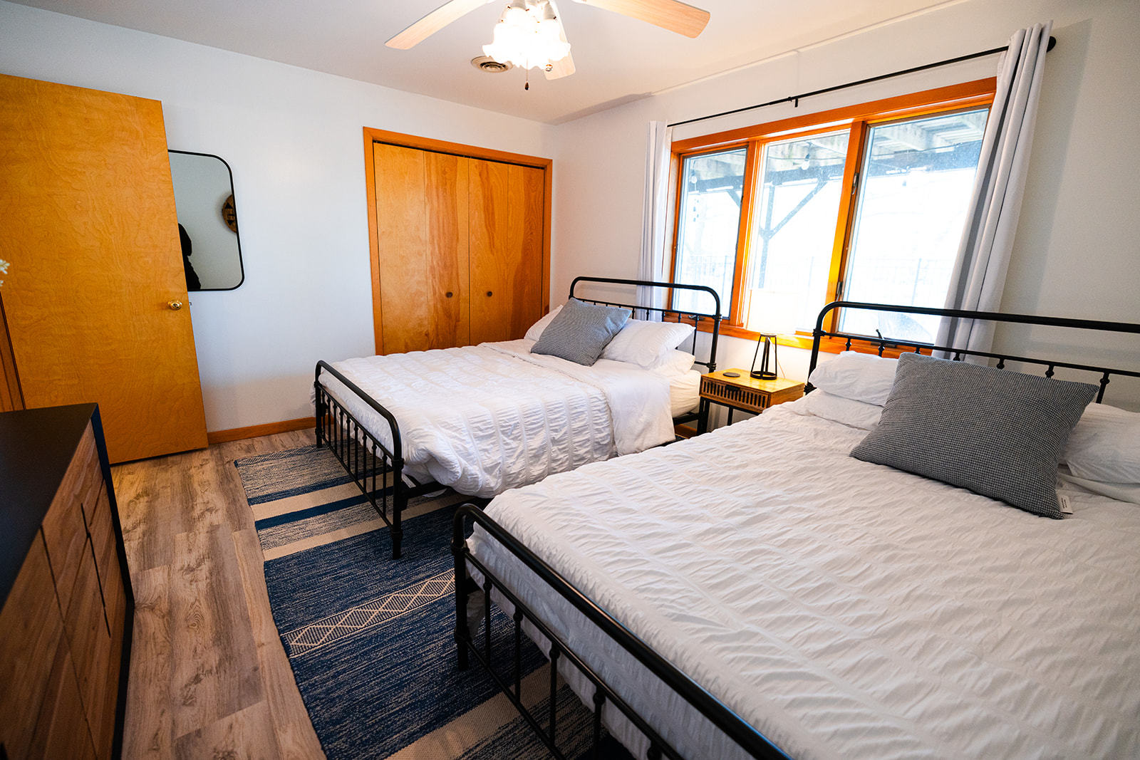 147 Lake Thunderbird Drive Putnam, IL 61560 - Photo 36 of 50 a bedroom with two beds and wooden floor