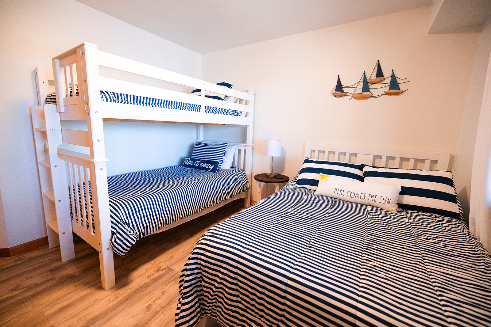 147 Lake Thunderbird Drive Putnam, IL 61560 - Photo 40 of 50 a bedroom with two beds and a chandelier