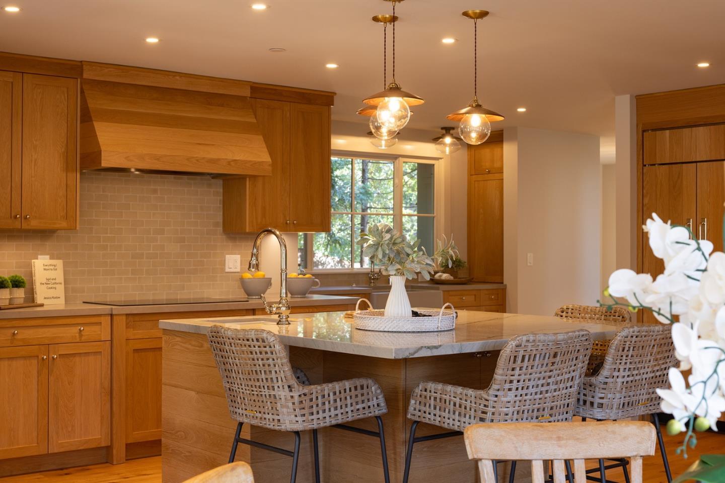 4 Oak Knoll Way Carmel, CA 93923 - Photo 11 of 49 a kitchen with a table and chairs in it