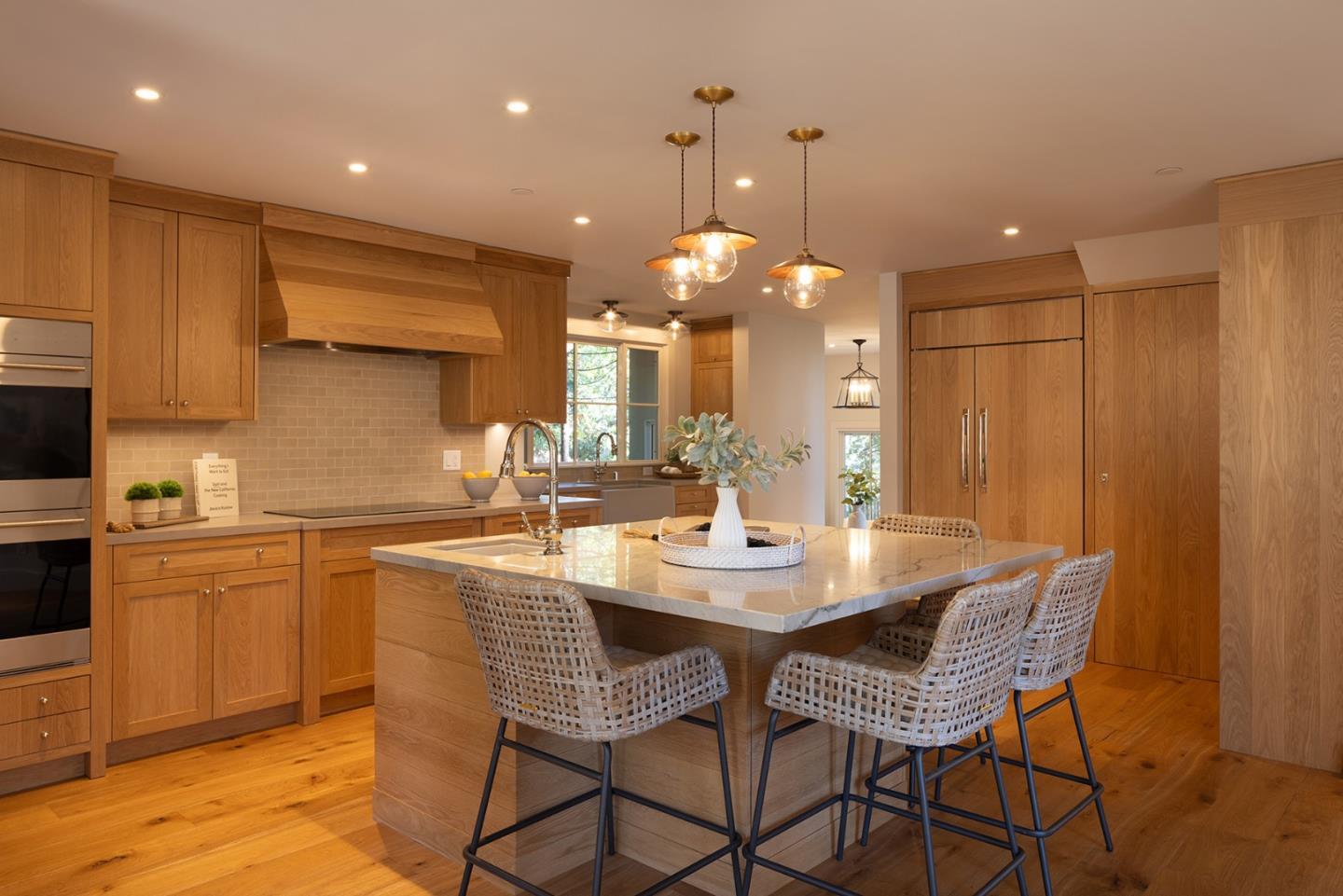4 Oak Knoll Way Carmel, CA 93923 - Photo 14 of 49 a kitchen with a dining table cabinets and stainless steel appliances