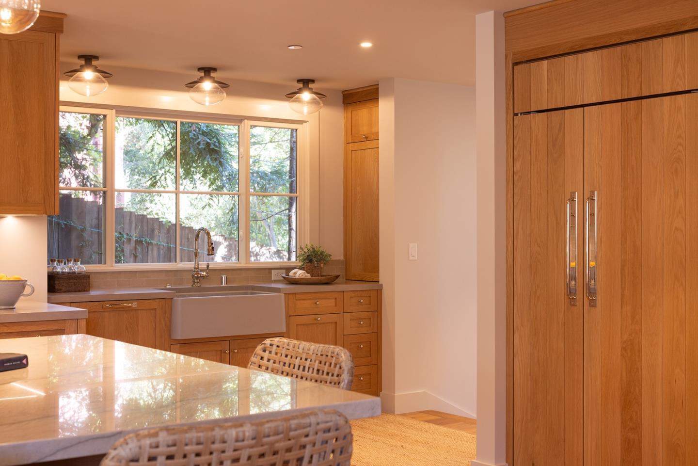 4 Oak Knoll Way Carmel, CA 93923 - Photo 18 of 49 a large white kitchen with a large window