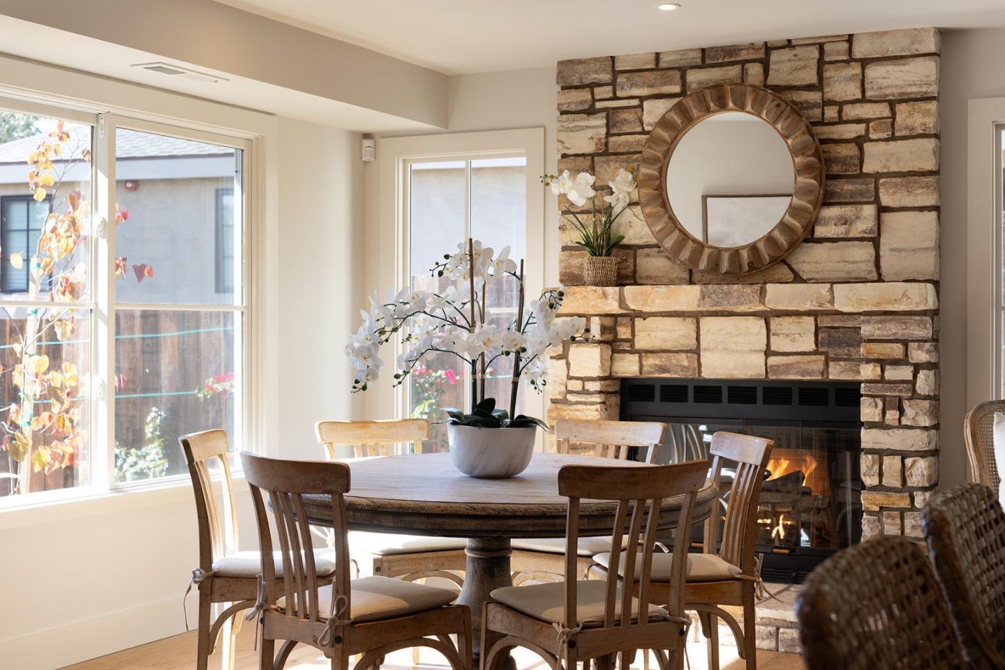 4 Oak Knoll Way Carmel, CA 93923 - Photo 23 of 49 a kitchen with a table and chairs in it