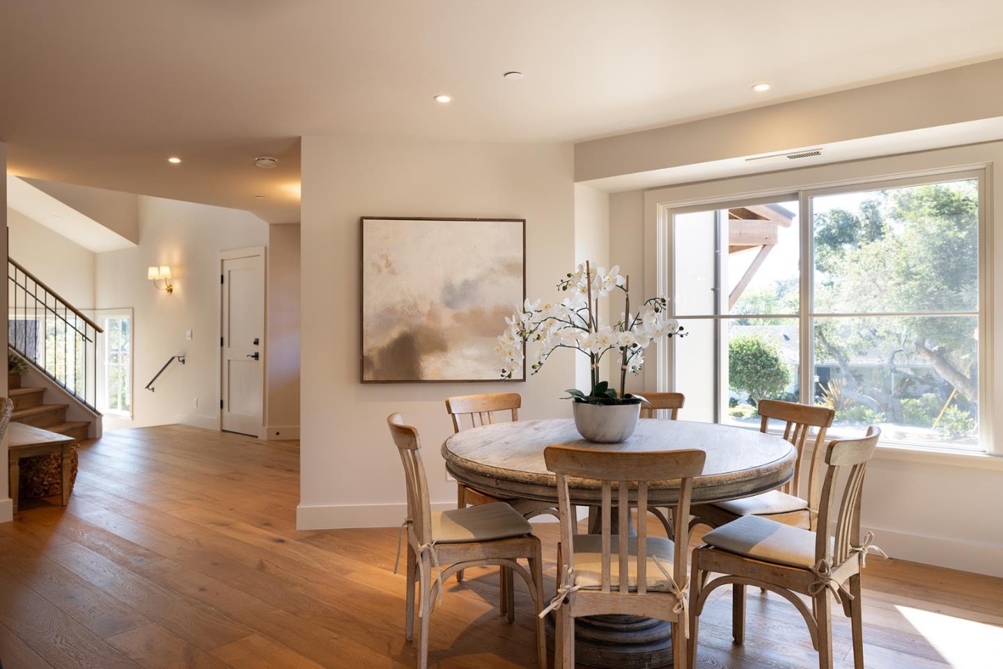 4 Oak Knoll Way Carmel, CA 93923 - Photo 25 of 49 a dining room with furniture large windows and wooden floor