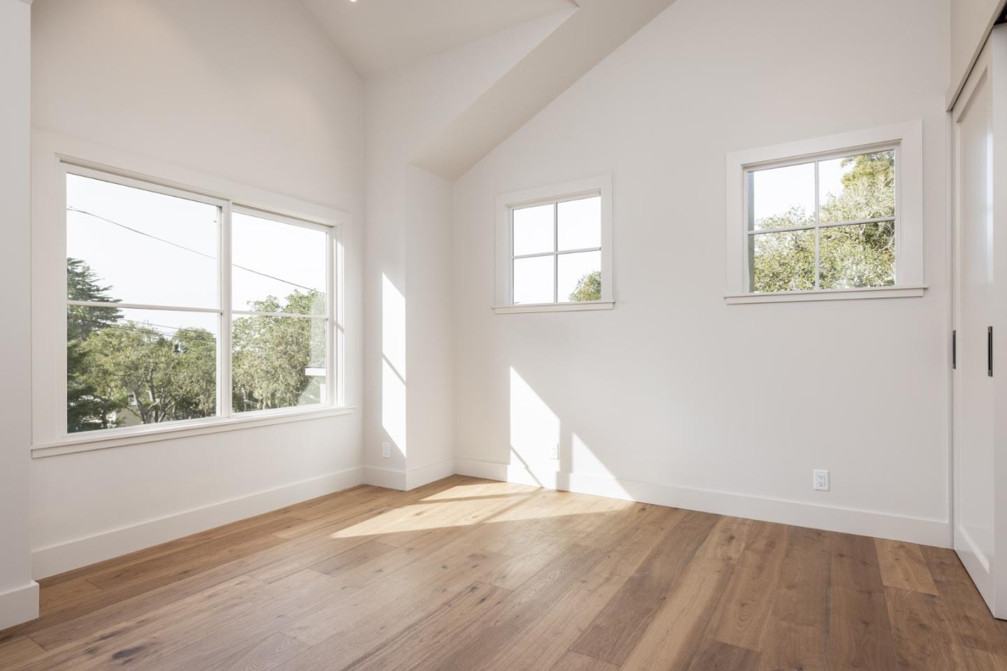 4 Oak Knoll Way Carmel, CA 93923 - Photo 46 of 49 an empty room with wooden floor and windows