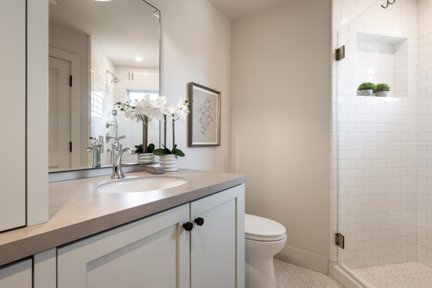 4 Oak Knoll Way Carmel, CA 93923 - Photo 47 of 49 a bathroom with a granite countertop sink a toilet and a mirror