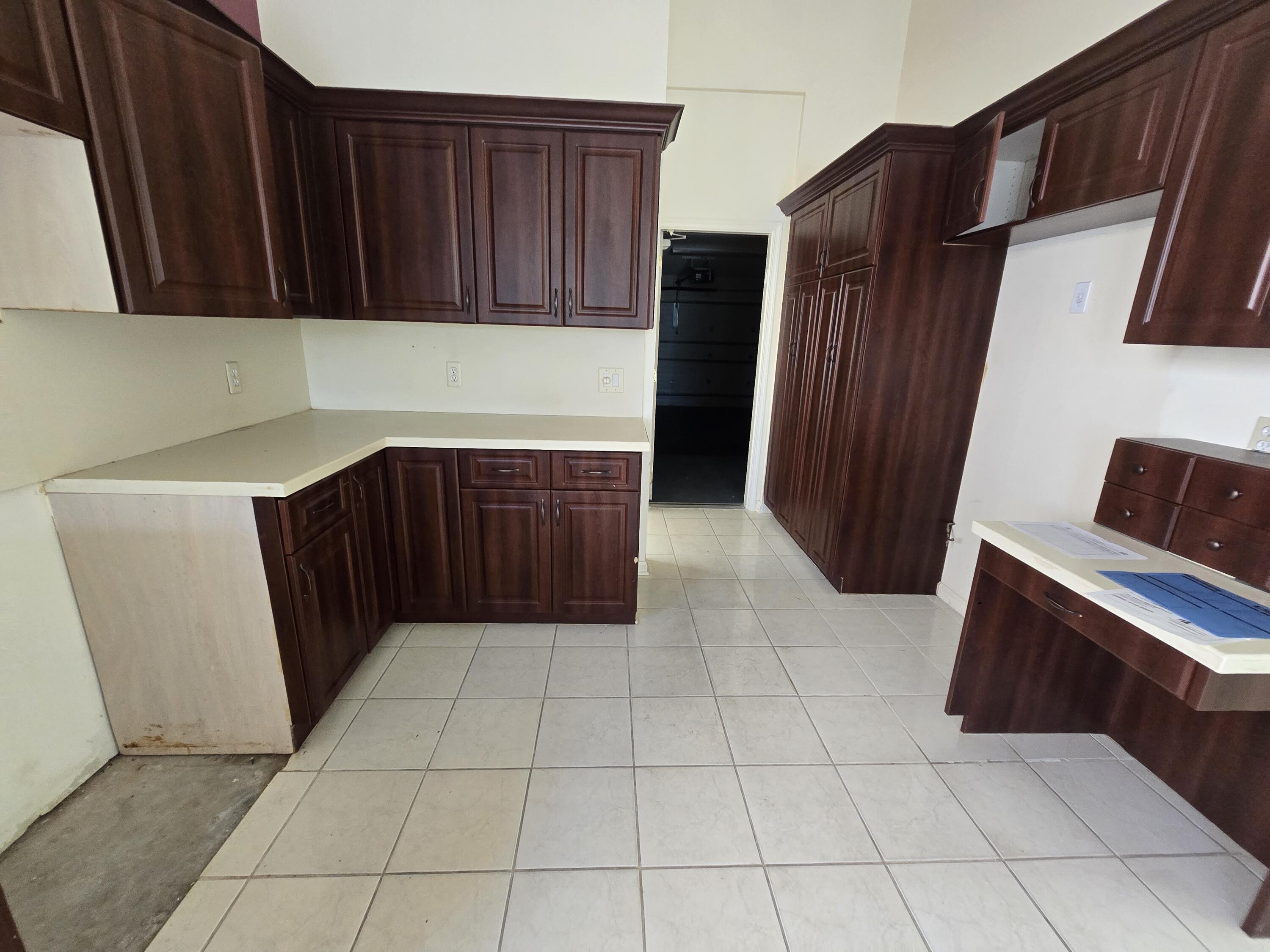 8384 Horseshoe Bay Road Boynton Beach, FL 33472 - Photo 16 of 33 a kitchen with stainless steel appliances a refrigerator and cabinets