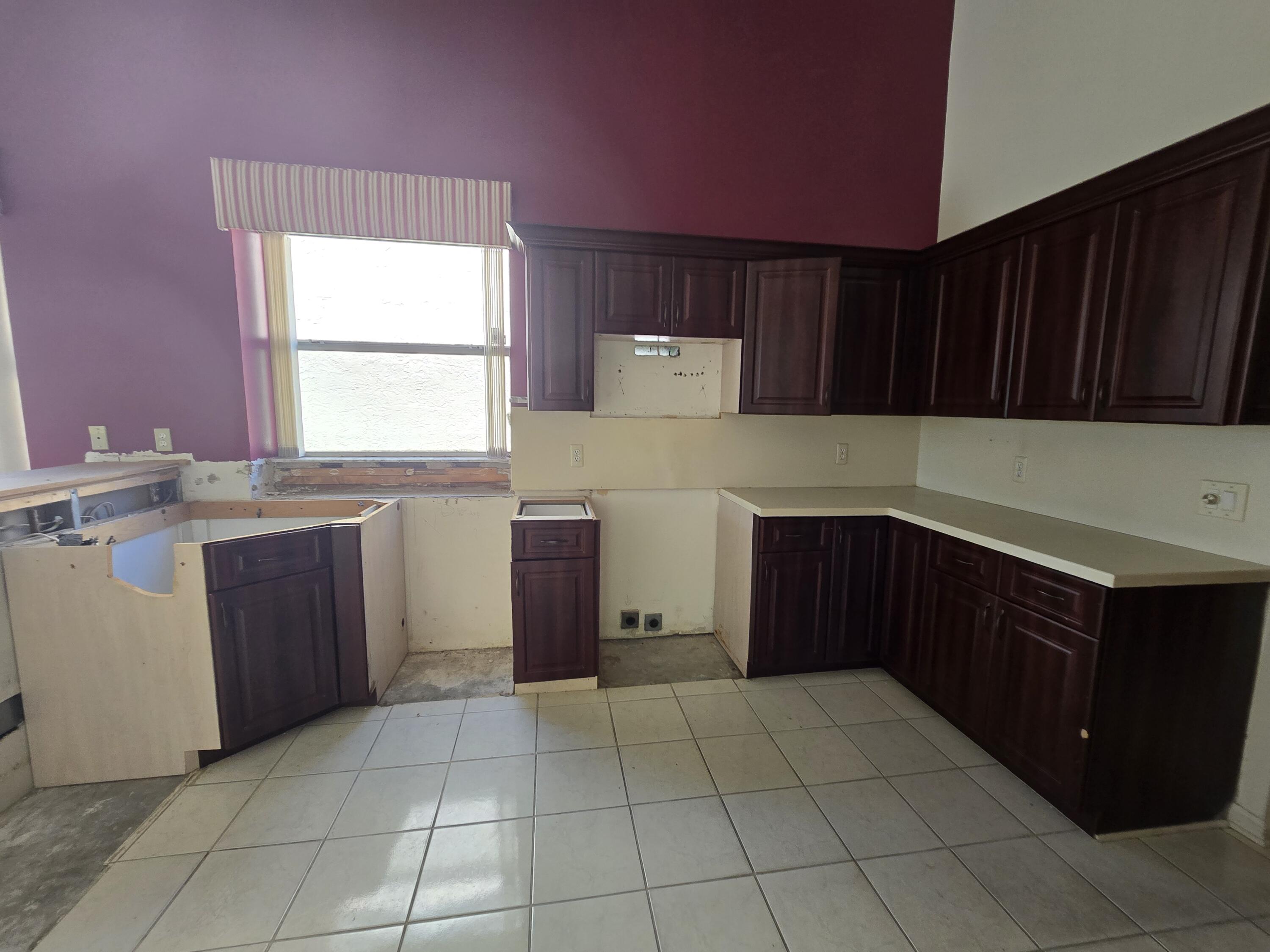 8384 Horseshoe Bay Road Boynton Beach, FL 33472 - Photo 17 of 33 a kitchen with a cabinets and a stove top oven