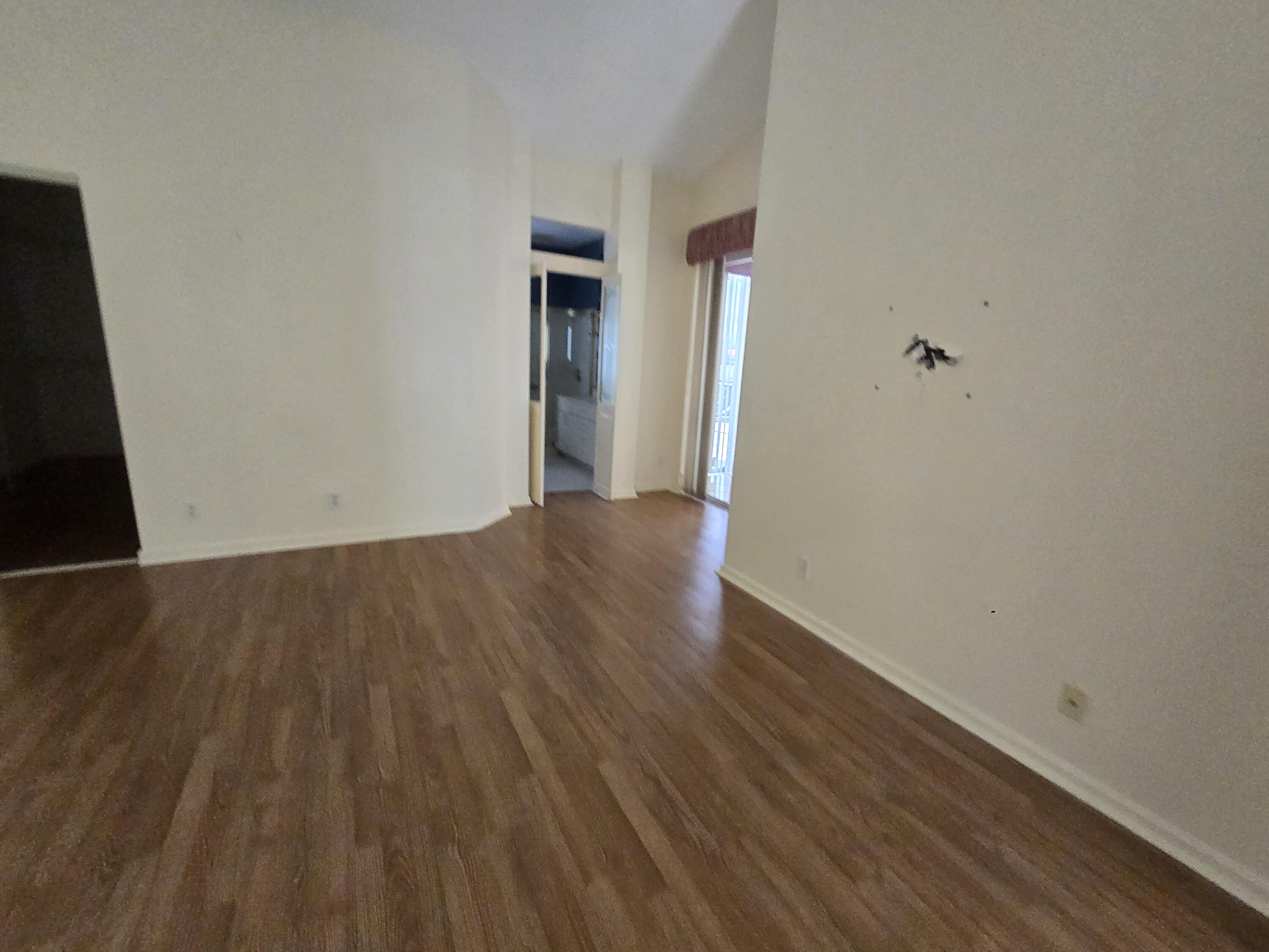 8384 Horseshoe Bay Road Boynton Beach, FL 33472 - Photo 28 of 33 a view of a room with wooden floor and a window