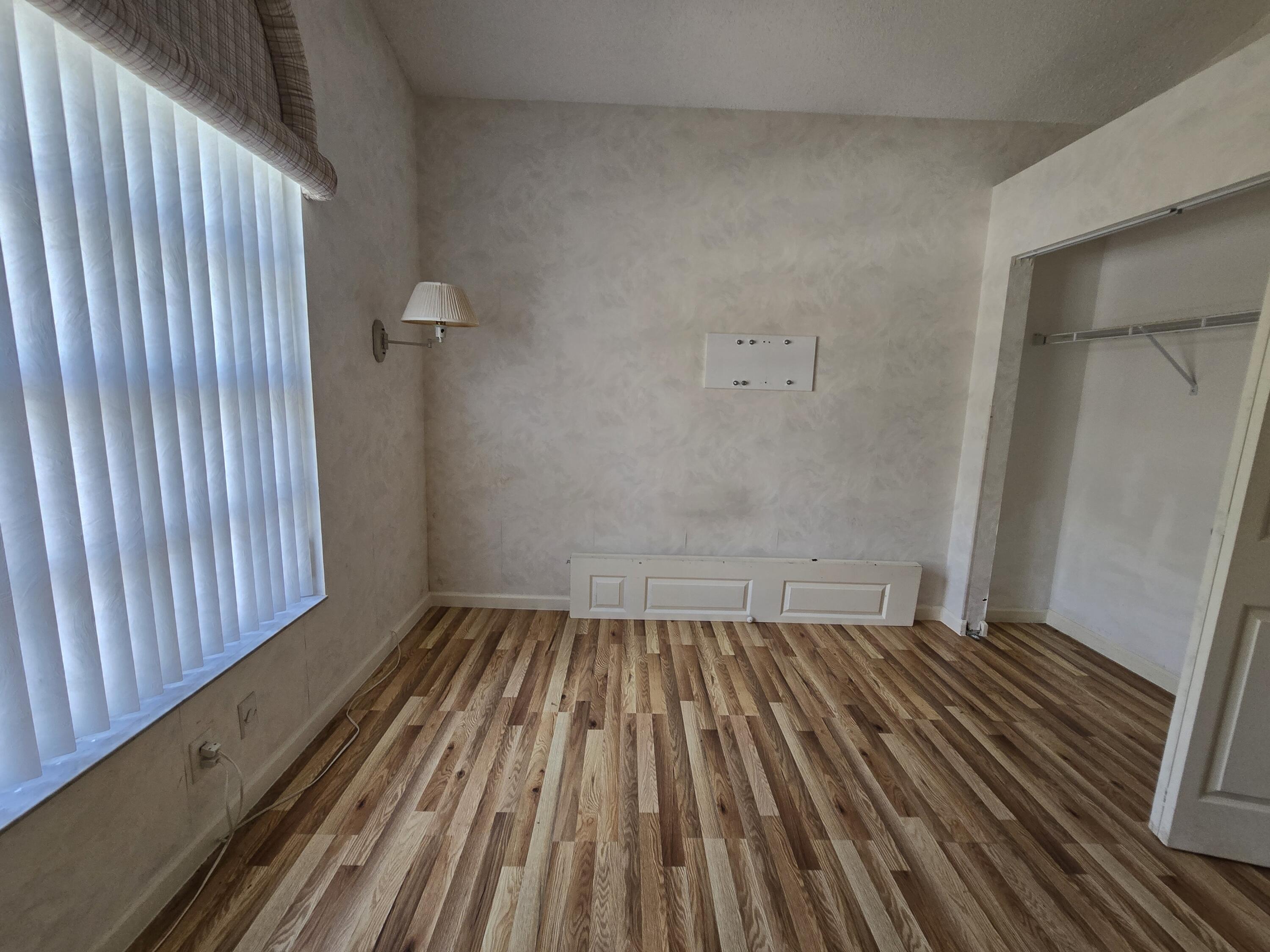 8384 Horseshoe Bay Road Boynton Beach, FL 33472 - Photo 3 of 33 a view of wooden floor in a bathroom