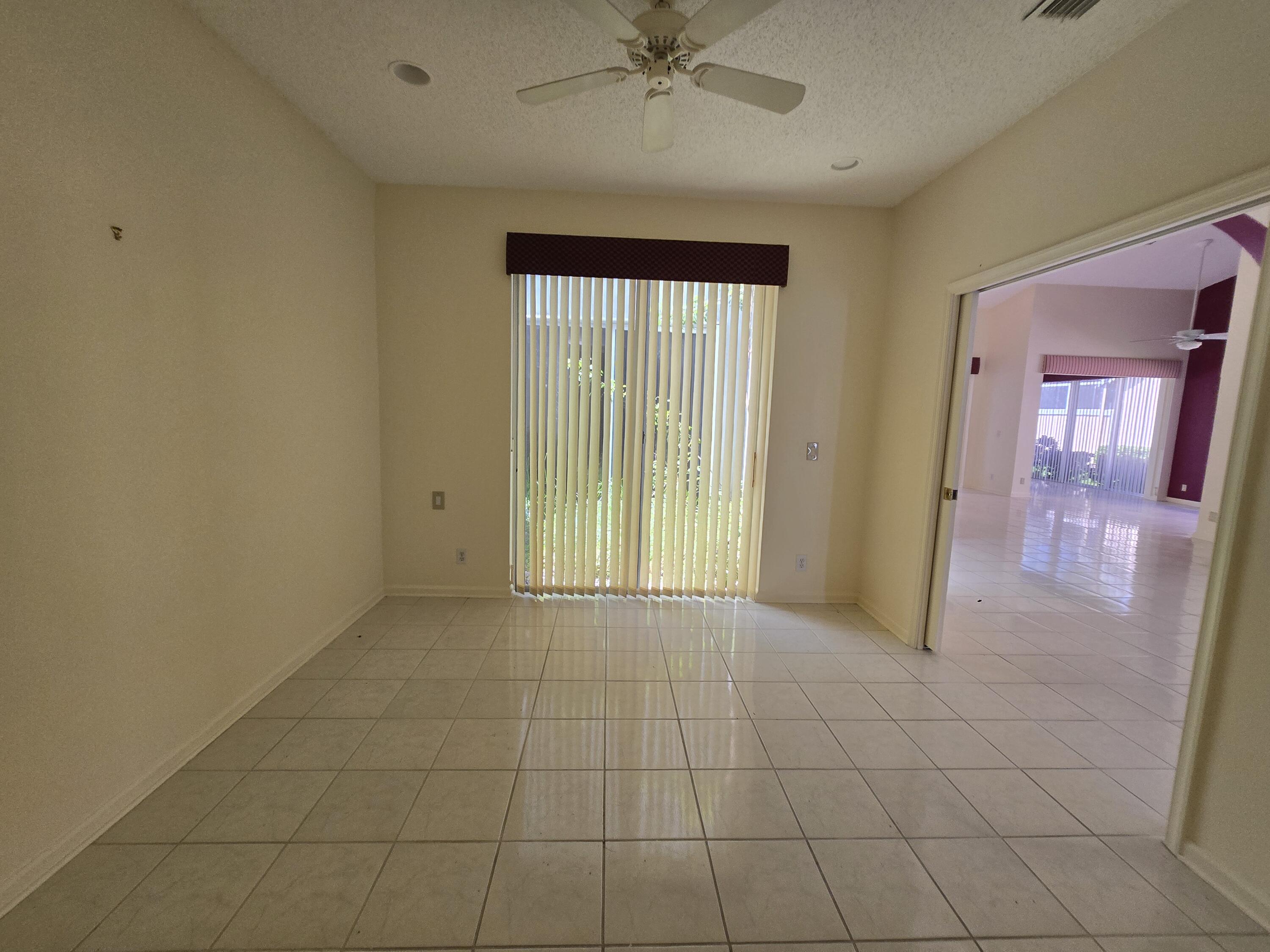 8384 Horseshoe Bay Road Boynton Beach, FL 33472 - Photo 8 of 33 a view of an empty room with a window