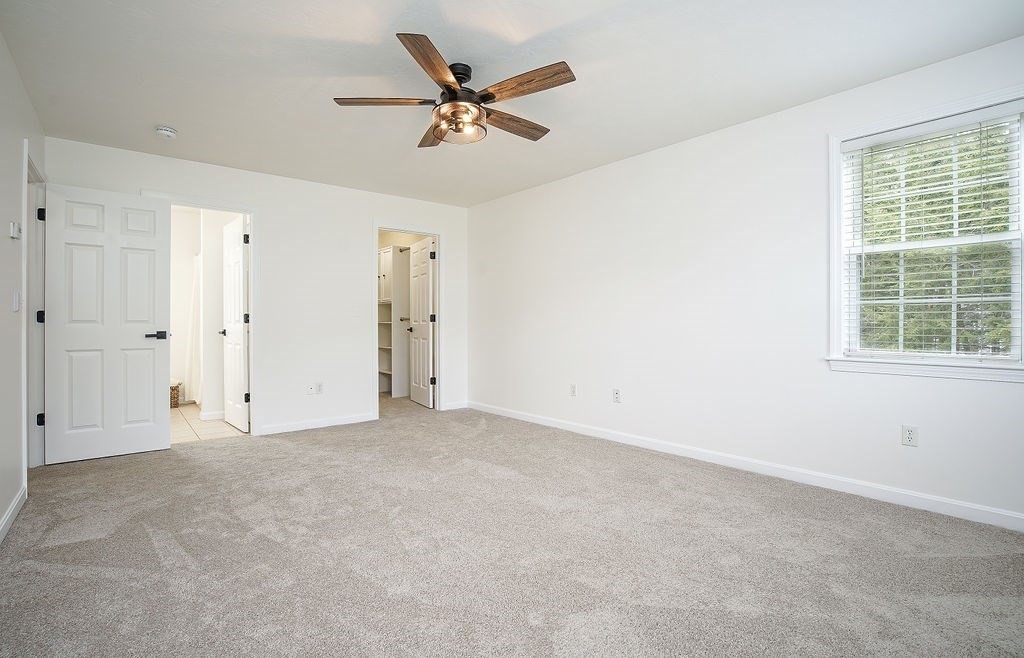 7 Draper Woods Road Sturbridge, MA 01518 - Photo 18 of 38 an empty room with a window