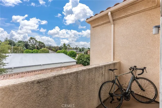 a view of a yard with wooden fence