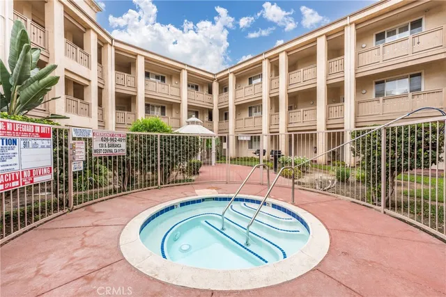 a view of building with outdoor space and swimming pool