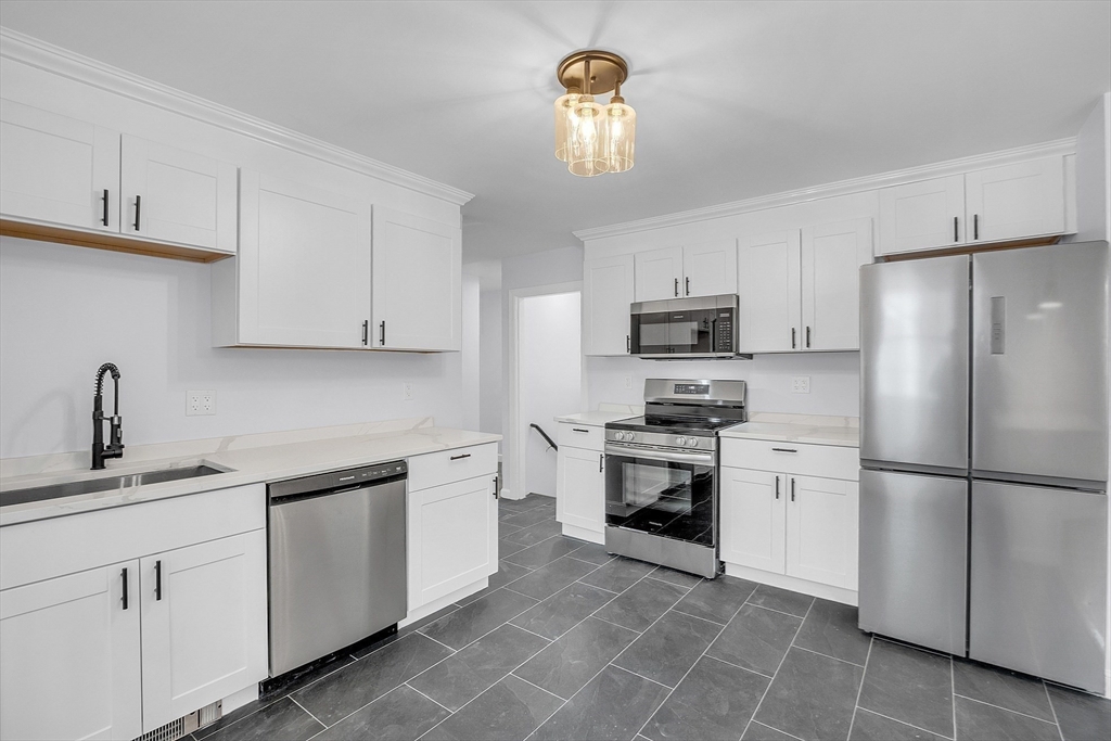 150 Fisher Road Fitchburg, MA 01420 - Photo 16 of 41 a kitchen with cabinets stainless steel appliances and a counter space