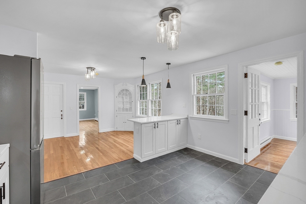 150 Fisher Road Fitchburg, MA 01420 - Photo 18 of 41 a kitchen with granite countertop white cabinets and window