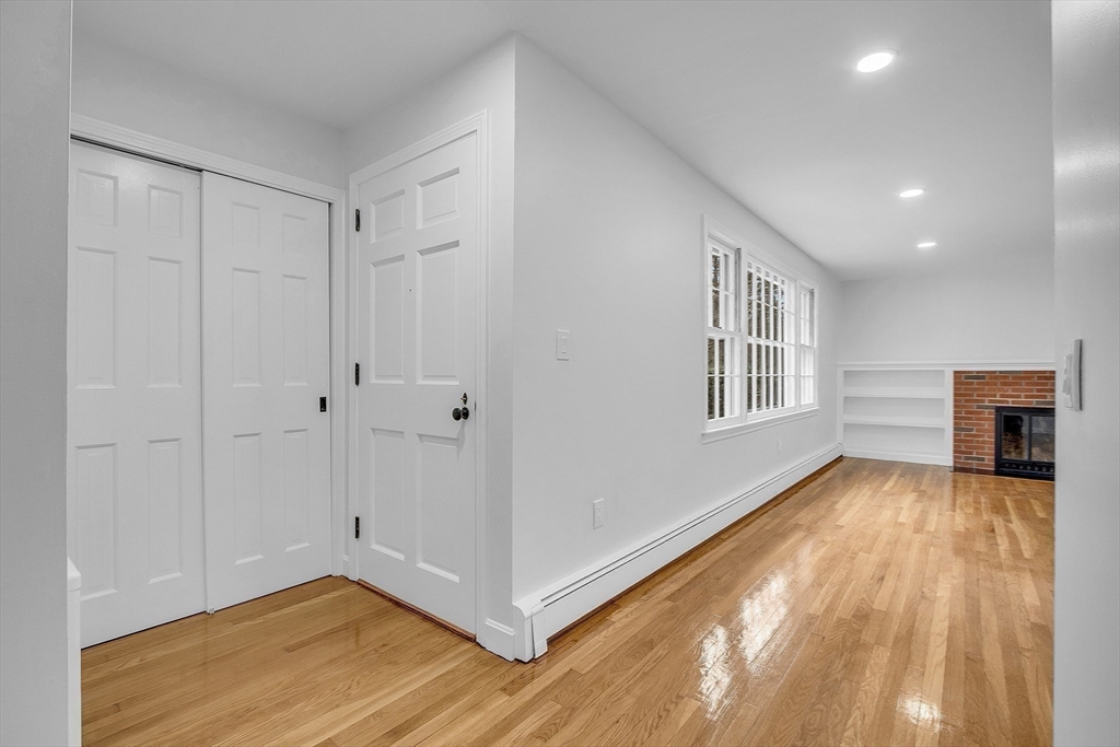 150 Fisher Road Fitchburg, MA 01420 - Photo 20 of 41 a view of a livingroom with an empty space and wooden floor
