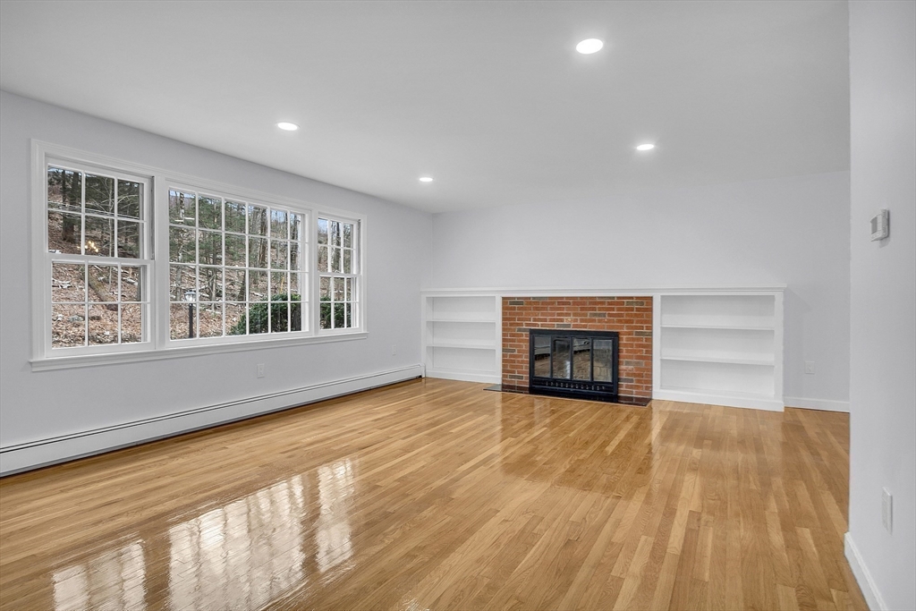 150 Fisher Road Fitchburg, MA 01420 - Photo 22 of 41 a view of an empty room with a window and wooden floor