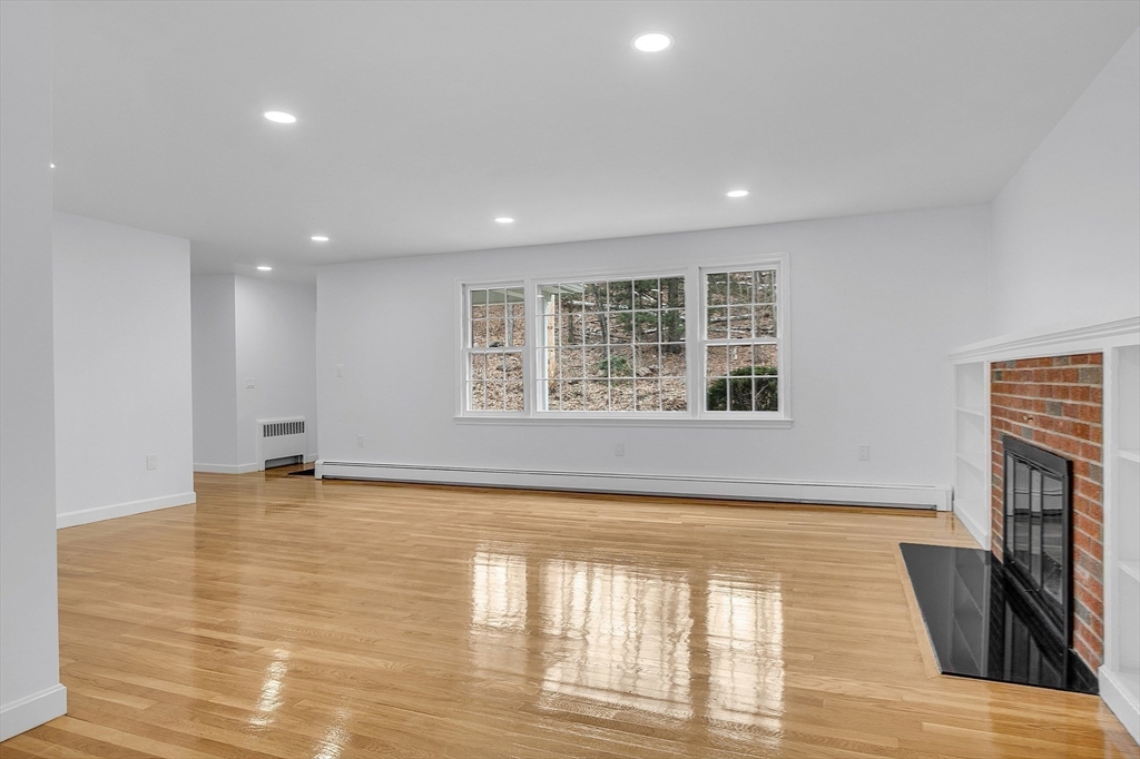 150 Fisher Road Fitchburg, MA 01420 - Photo 24 of 41 a view of an empty room with wooden floor and a window