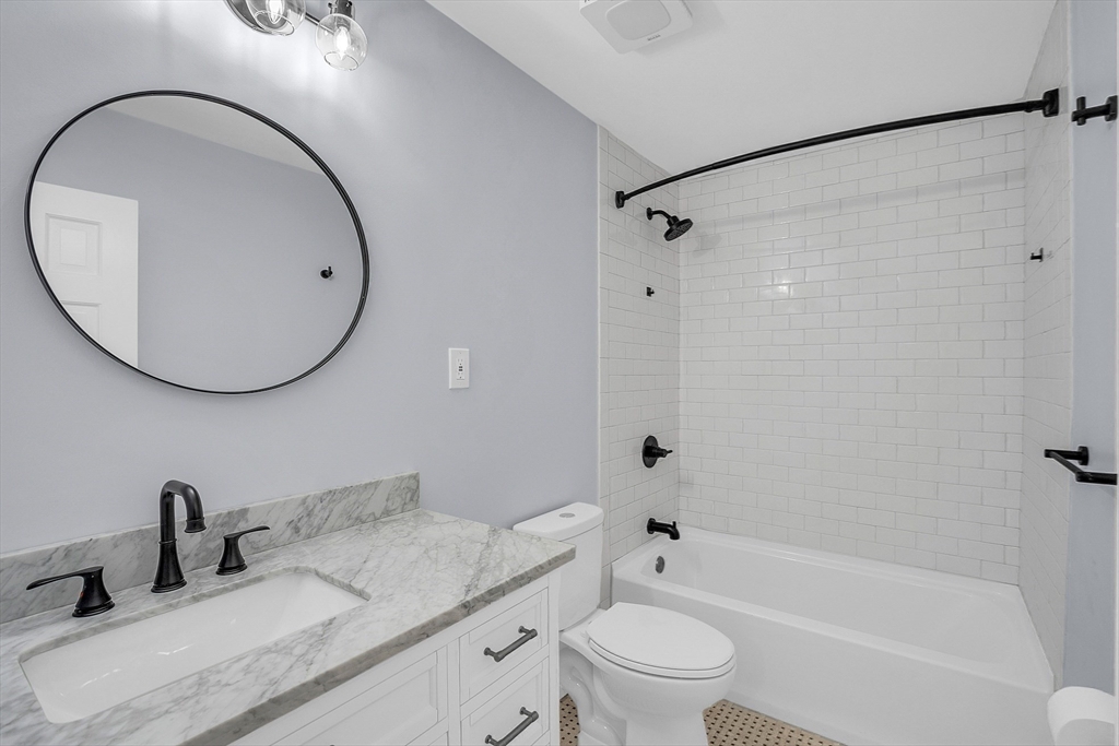 150 Fisher Road Fitchburg, MA 01420 - Photo 28 of 41 a bathroom with a granite countertop sink mirror toilet and bathtub
