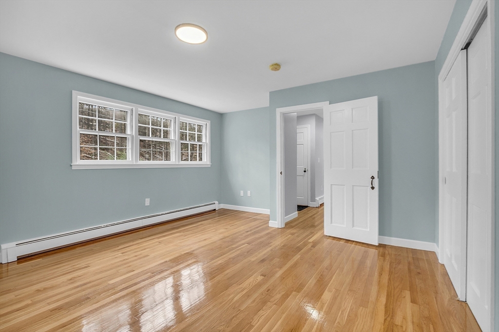 150 Fisher Road Fitchburg, MA 01420 - Photo 30 of 41 a view of empty room with wooden floor and fan