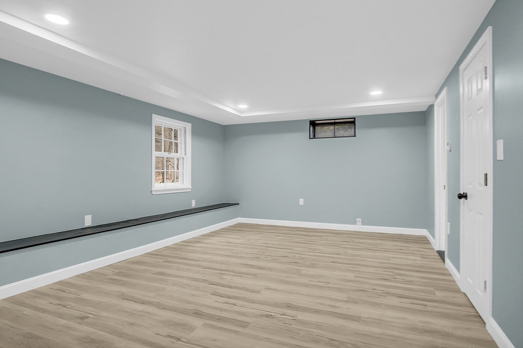 150 Fisher Road Fitchburg, MA 01420 - Photo 32 of 41 a view of an empty room with wooden floor and a window