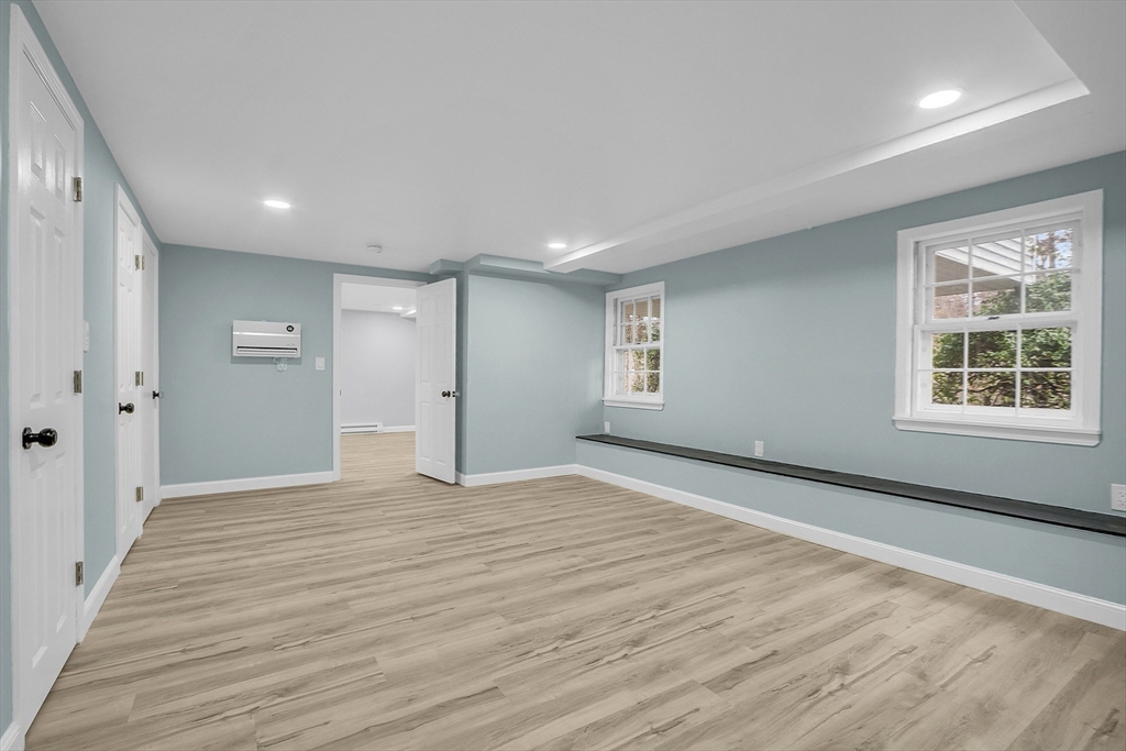 150 Fisher Road Fitchburg, MA 01420 - Photo 33 of 41 a view of an empty room with wooden floor and a window