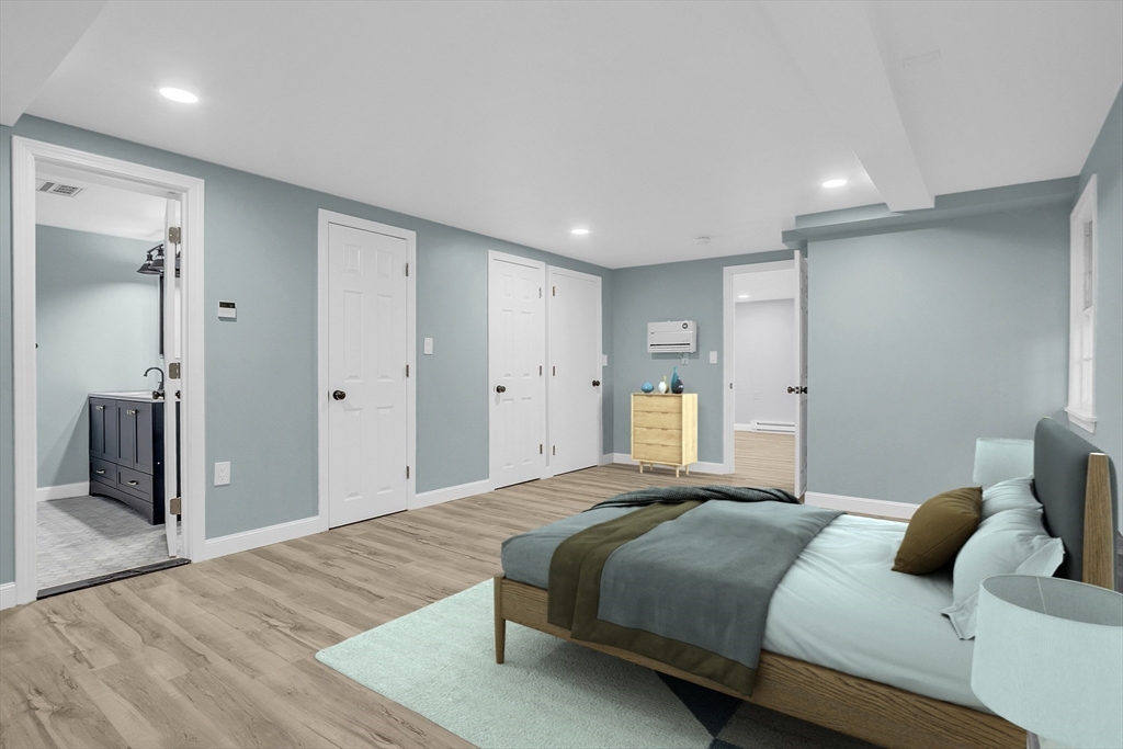 150 Fisher Road Fitchburg, MA 01420 - Photo 9 of 41 a spacious bedroom with a bed and a walk in closet