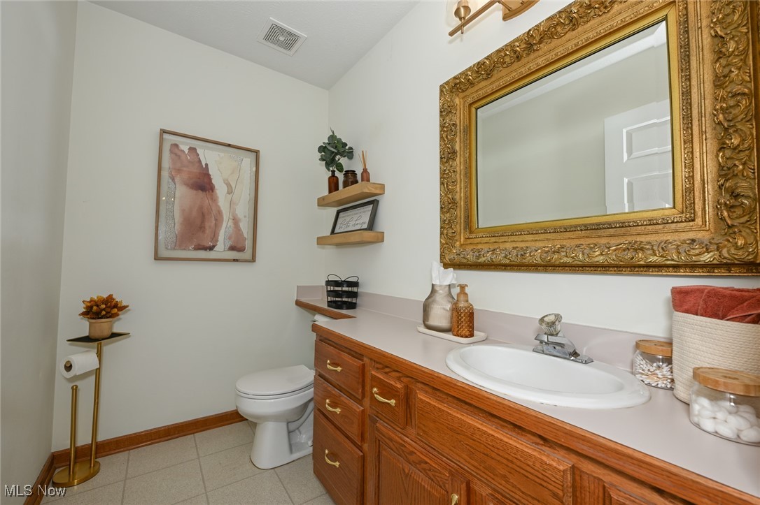 4845 State Road Medina, OH 44256 - Photo 23 of 47 Half bathroom featuring vanity and light tile patterned flooring