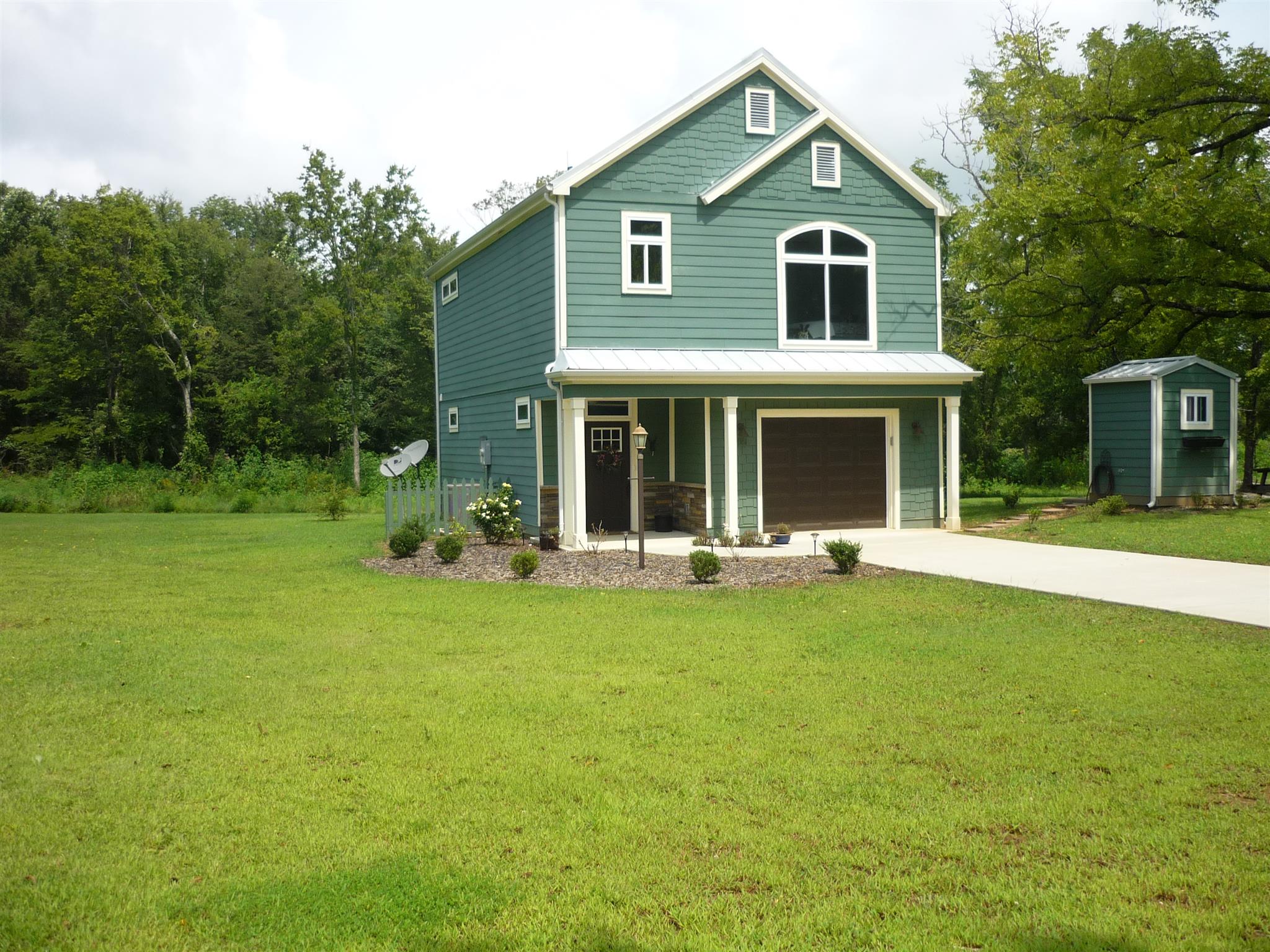 705 Union Ridge Road Wartrace, TN 37183 - Photo 1 of 13 a front view of house with yard and green space