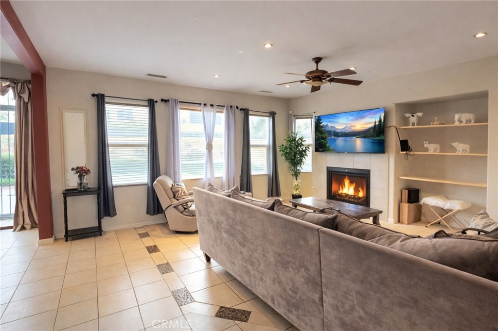 3116 Peaceful Way Lancaster, CA 93535 - Photo 4 of 10 Fireplace flame and television imagery shown in photos are digitally enhanced.