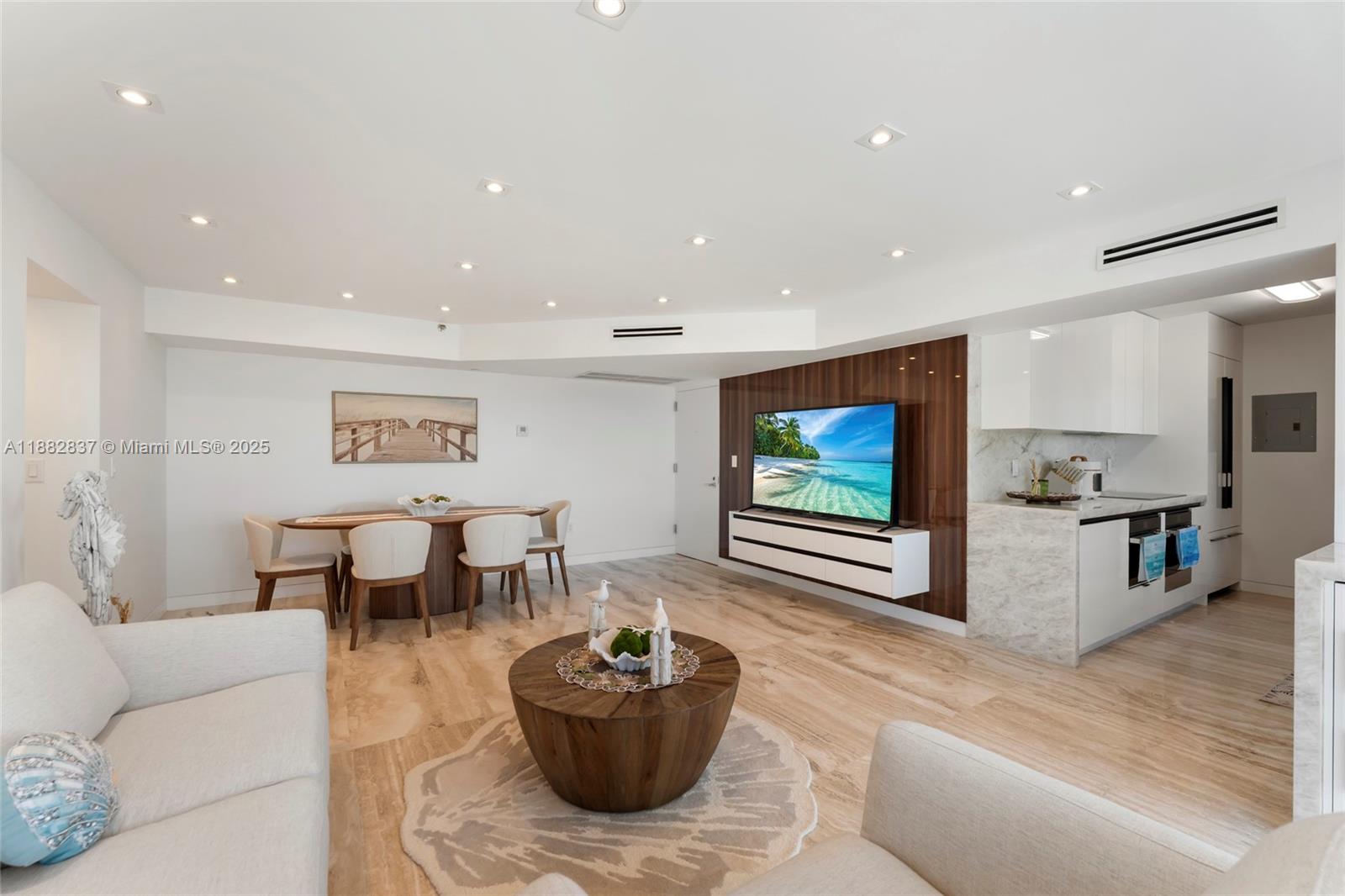 5900 Collins Avenue, Unit 604 Miami Beach, FL 33140 - Photo 13 of 30 a living room with furniture and a flat screen tv