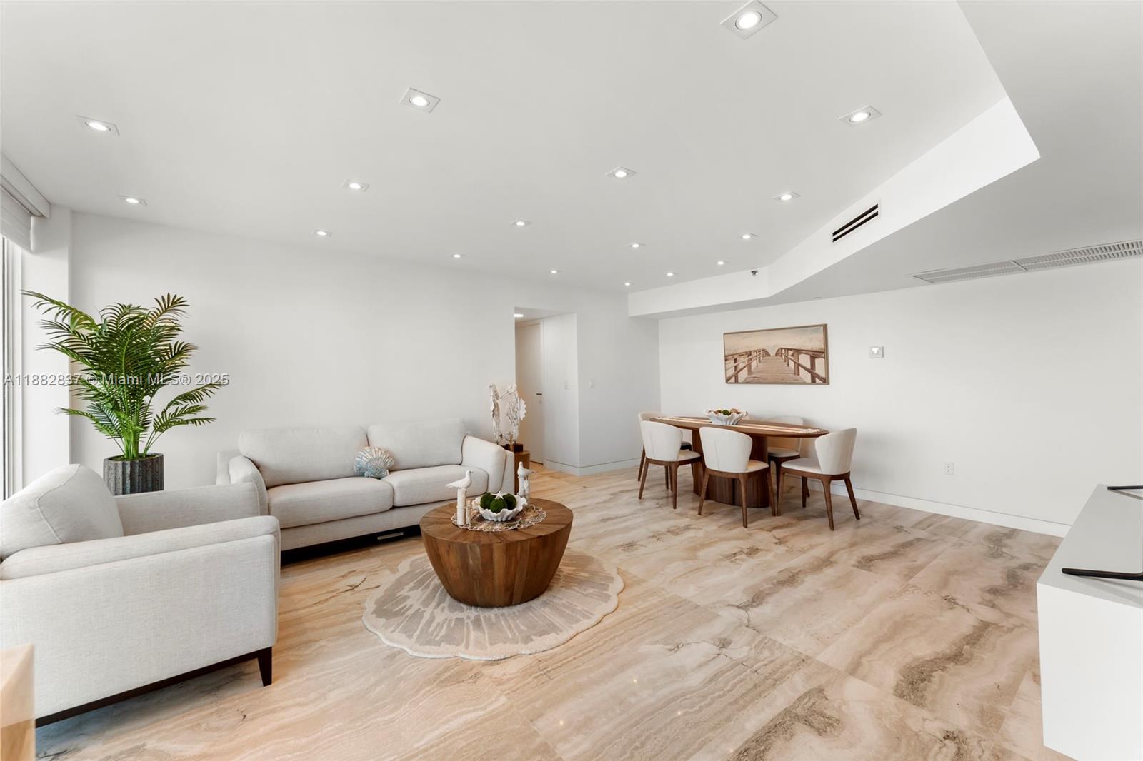 5900 Collins Avenue, Unit 604 Miami Beach, FL 33140 - Photo 14 of 30 a living room with furniture and a table